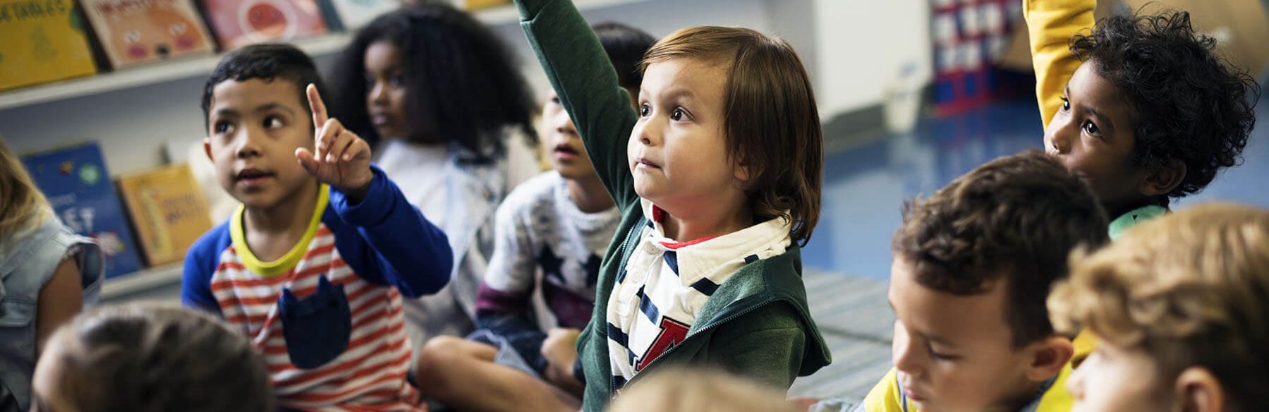 student raising their hand
