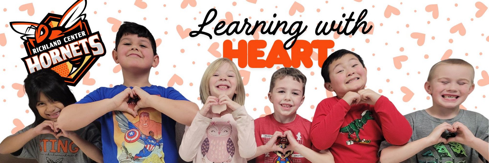 Kids making heart shape with hands - Learning with Heart